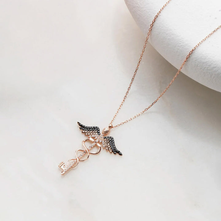 Necklace with angel wing pendant on a white background