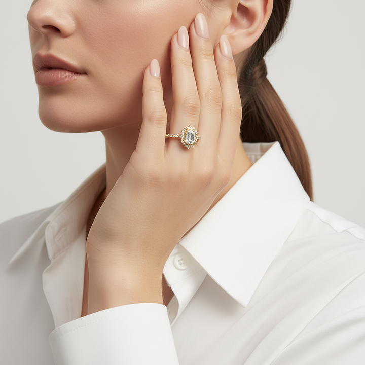 Woman wearing a diamond ring on her hand with a plain background
