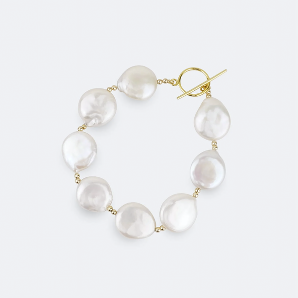 Baroque pearl necklace with gold clasp on a white background