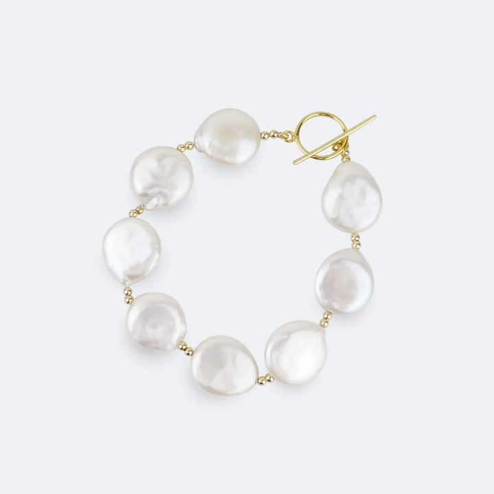 Baroque pearl necklace with gold clasp on a white background