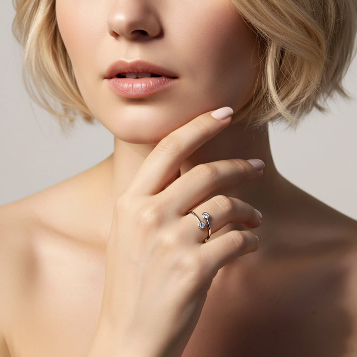 Close-up of a woman's hand wearing a ring with a blurred background