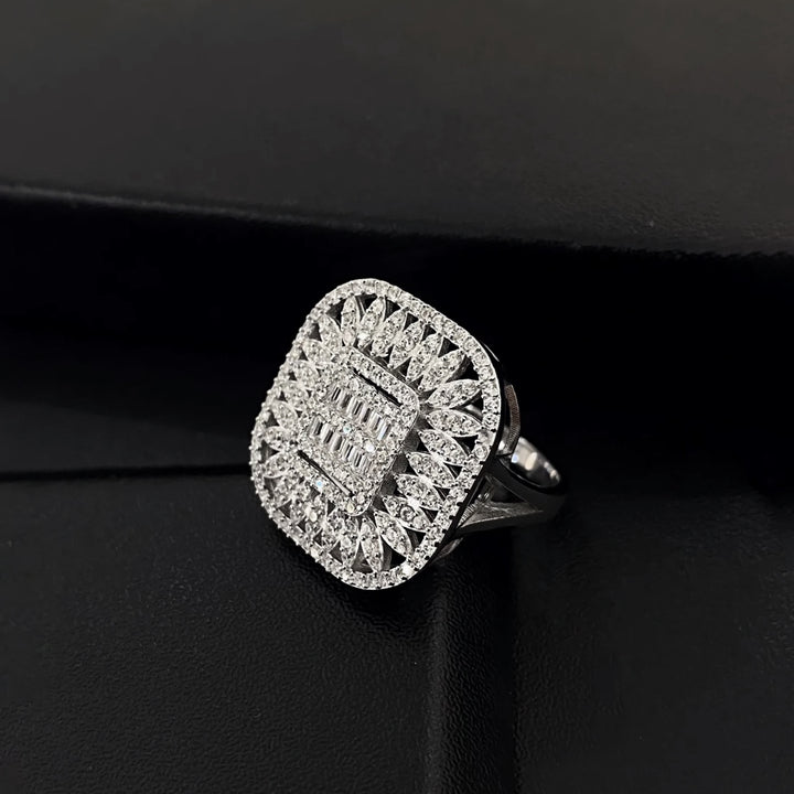 Silver ring with diamond accents on a black background
