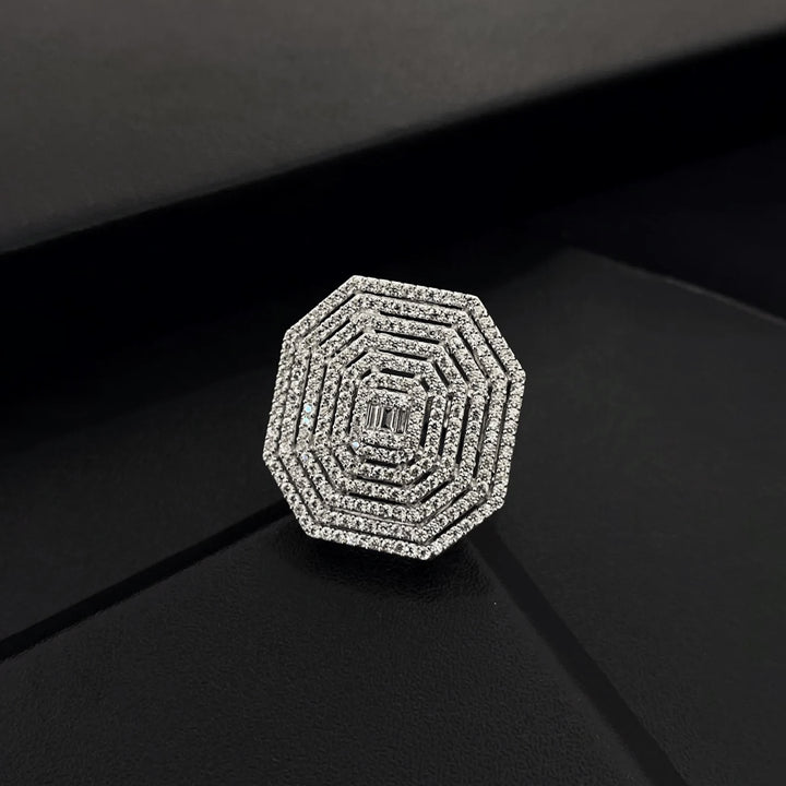 Diamond-studded hexagonal ring on a black background
