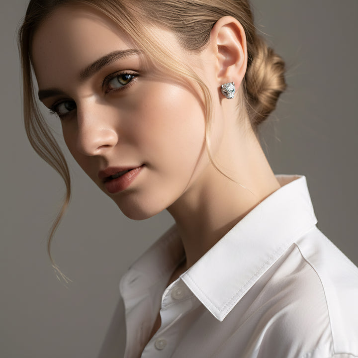 Close-up of a woman wearing a white shirt with a neutral background