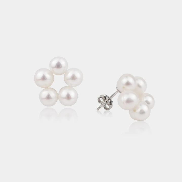 Pair of pearl earrings on a white background