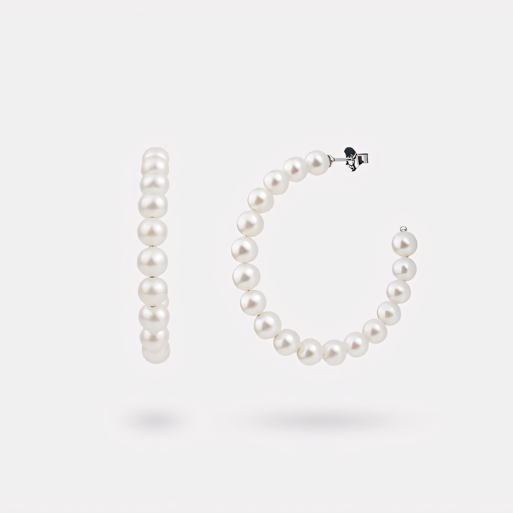 Pearl hoop earrings on a white background
