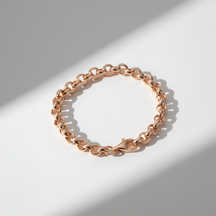 Rose gold chain bracelet on a light background