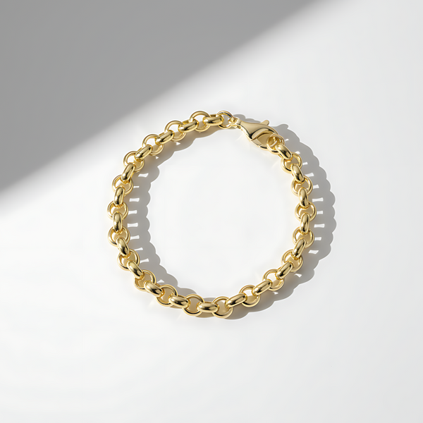 Gold chain bracelet on a white background