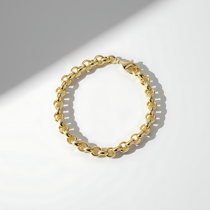 Gold chain bracelet on a white background